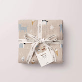 Dog print muslin swaddle tied with ribbon for gifting